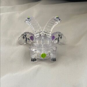 Clear Plastic Toy with Green and Purple Accents